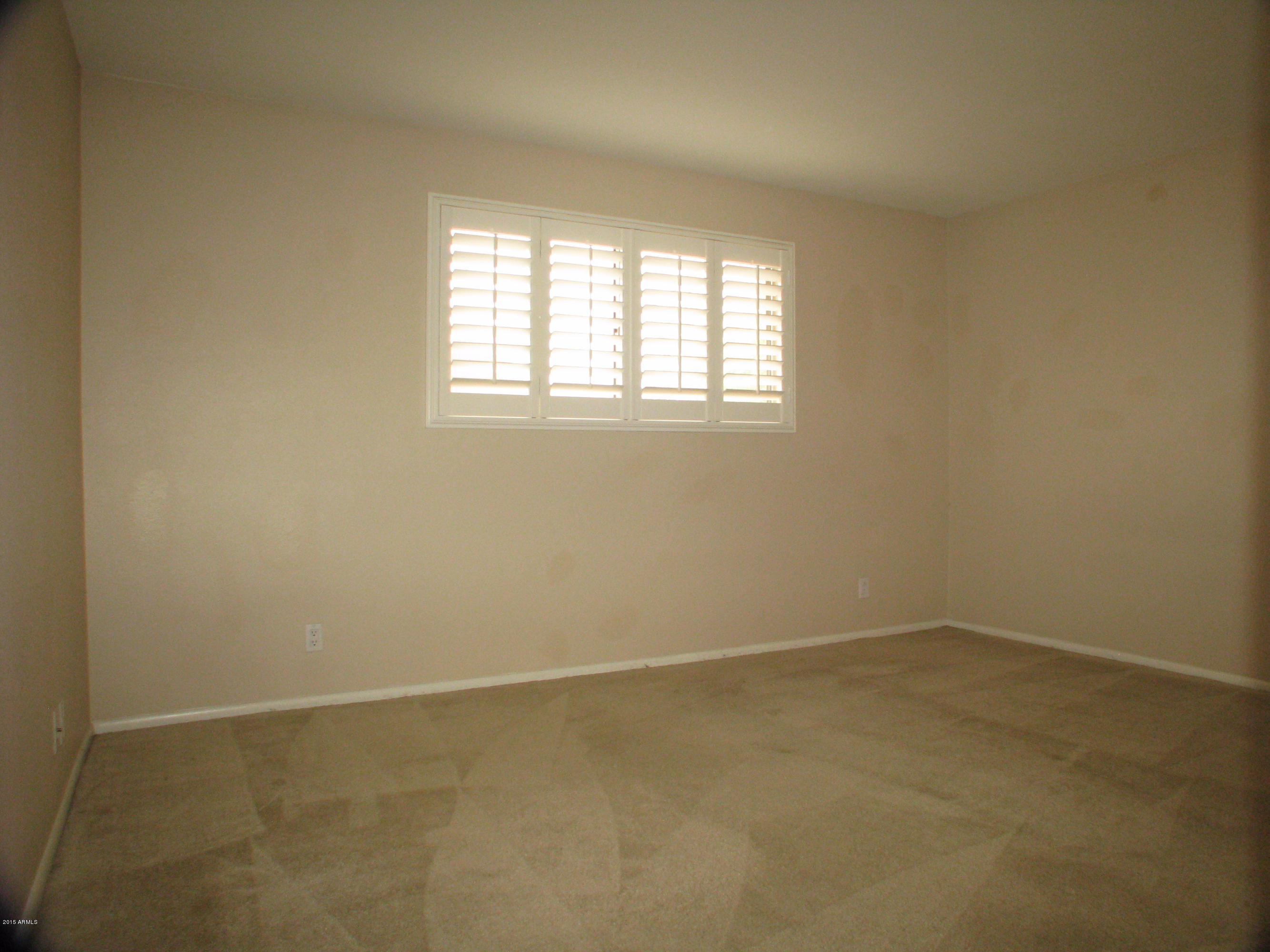 3807 North 30th Street, Unit 8 Phoenix, AZ 85016 - Photo 15 of 24 an empty room with a window
