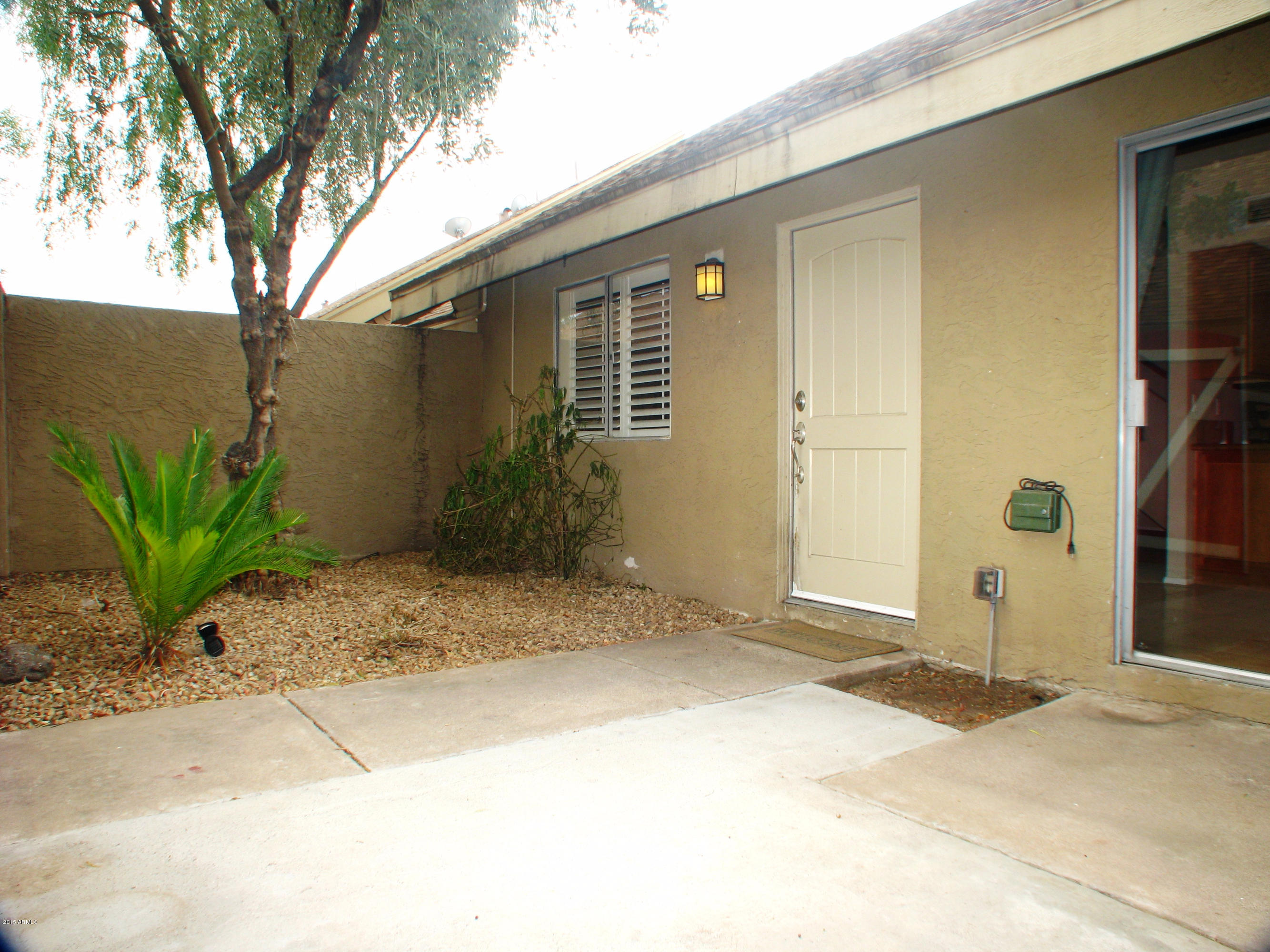 3807 North 30th Street, Unit 8 Phoenix, AZ 85016 - Photo 20 of 24 a view of a house with a backyard