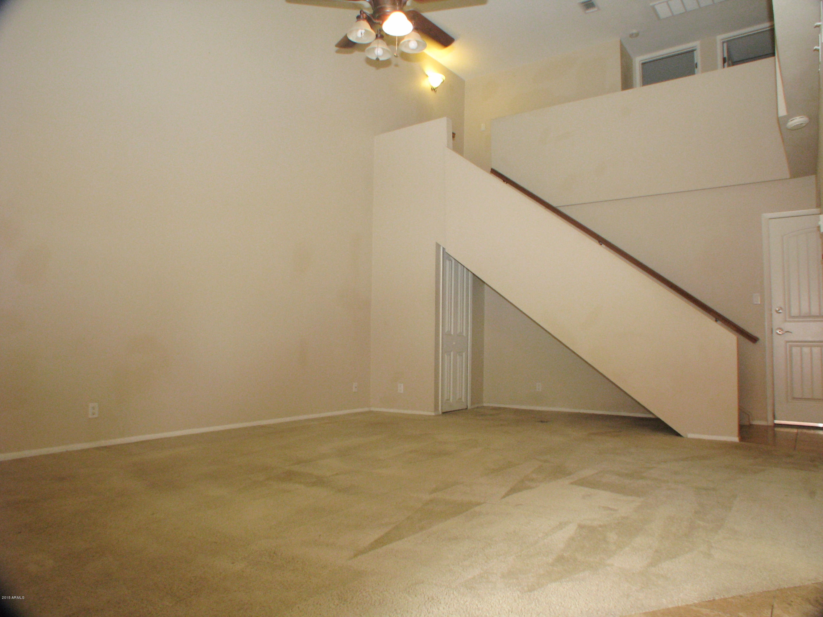 3807 North 30th Street, Unit 8 Phoenix, AZ 85016 - Photo 2 of 24 a view of an empty room with a ceiling fan