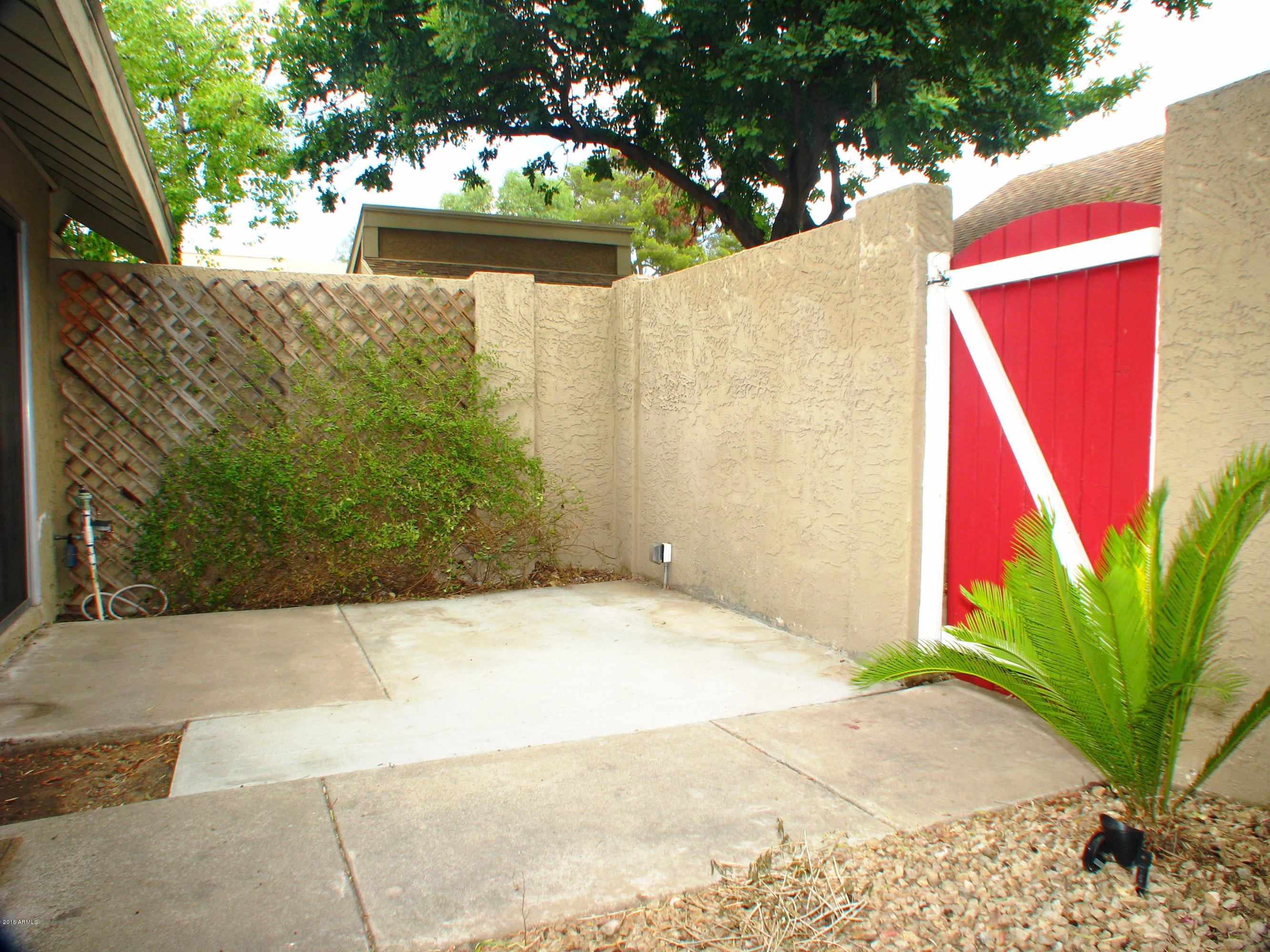 3807 North 30th Street, Unit 8 Phoenix, AZ 85016 - Photo 21 of 24 a view of a house with a yard