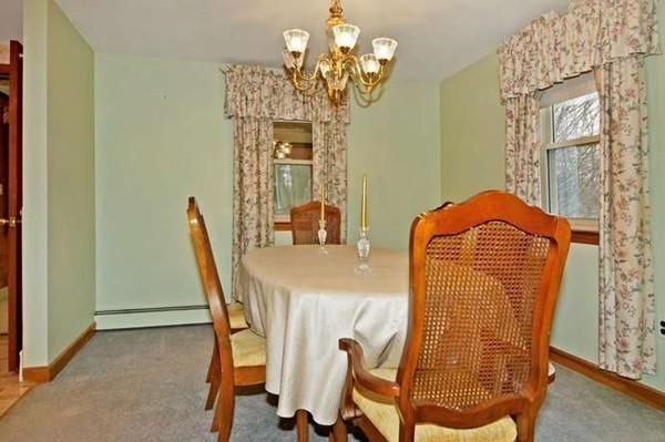 4 Thistle Road Woburn, MA 01801 - Photo 12 of 24 a dining room with furniture and chandelier
