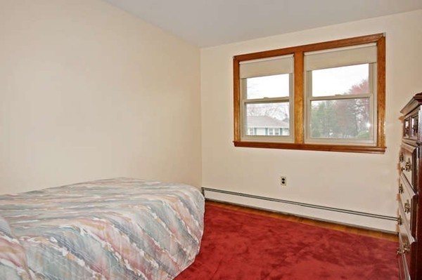 4 Thistle Road Woburn, MA 01801 - Photo 18 of 24 a view of an empty room with a window