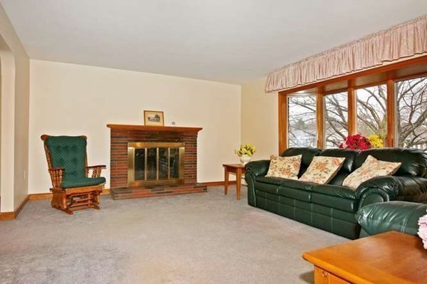 4 Thistle Road Woburn, MA 01801 - Photo 8 of 24 a living room with furniture and a fireplace