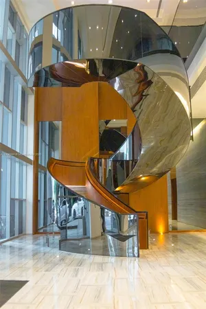 a view of empty room with a floor to ceiling window and kitchen