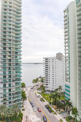 a view of a palm trees in front of a building