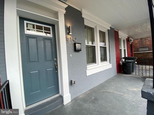 a view of a hallway with some storage and utility room