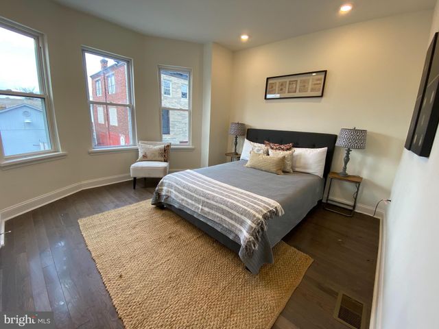 a bedroom with a bed and a couch