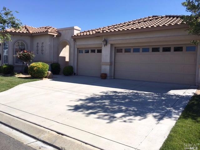 Front of home showing 3 car garage
