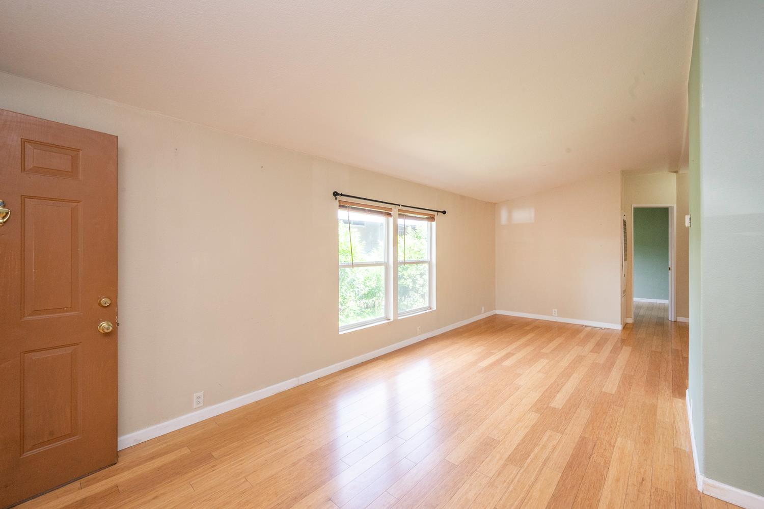 132 Danielle Way Folsom, CA 95630 - Photo 13 of 52 an empty room with wooden floor and windows