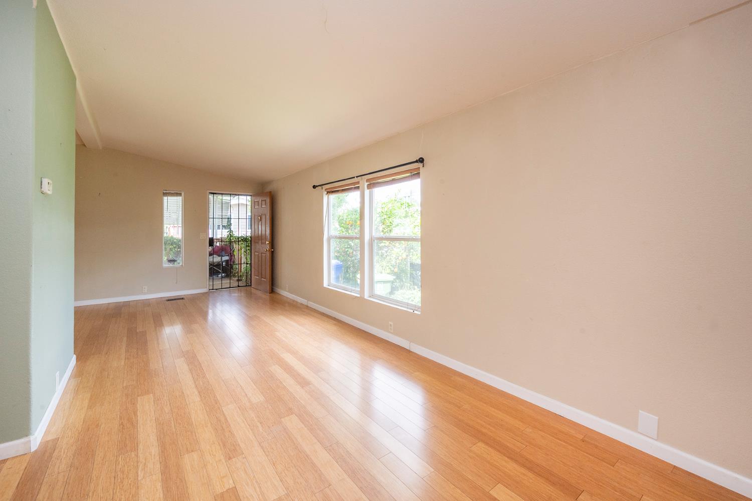 132 Danielle Way Folsom, CA 95630 - Photo 19 of 52 a view of empty room with wooden floor and fan