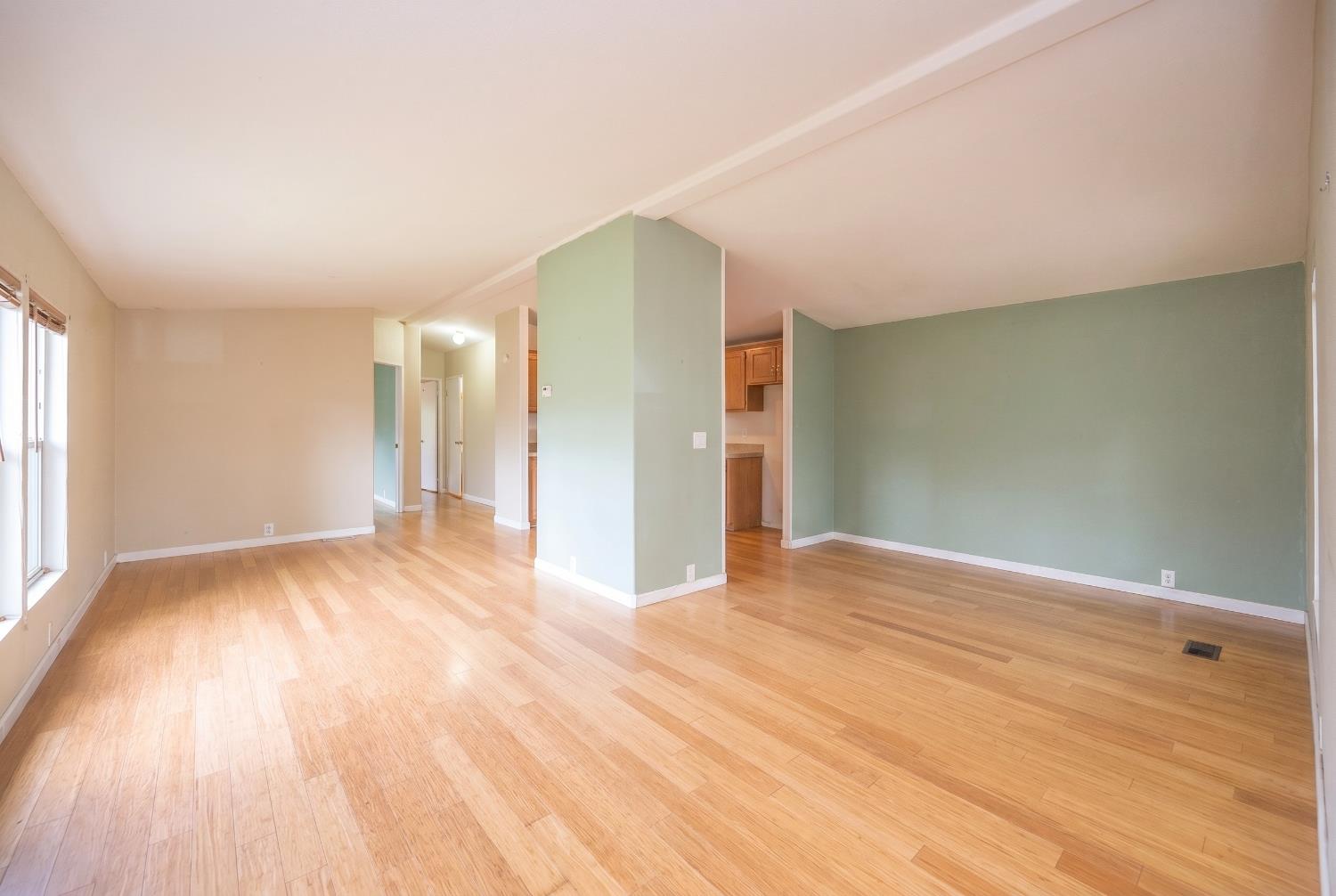 132 Danielle Way Folsom, CA 95630 - Photo 20 of 52 a view of an empty room with wooden floor and a window
