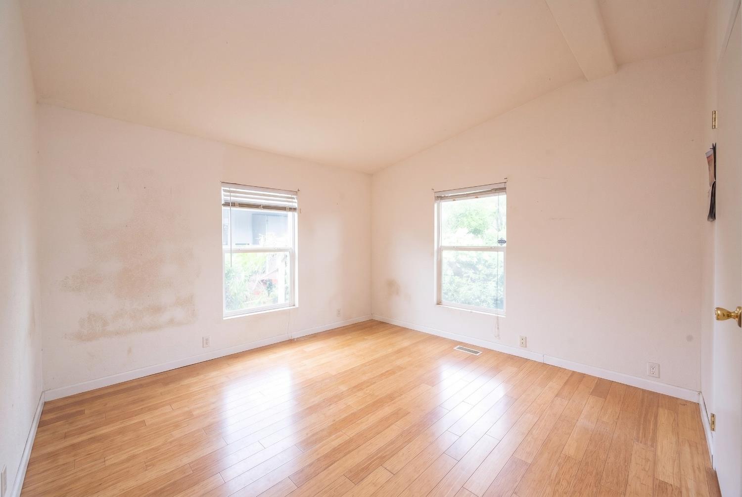 132 Danielle Way Folsom, CA 95630 - Photo 35 of 52 an empty room with wooden floor and windows