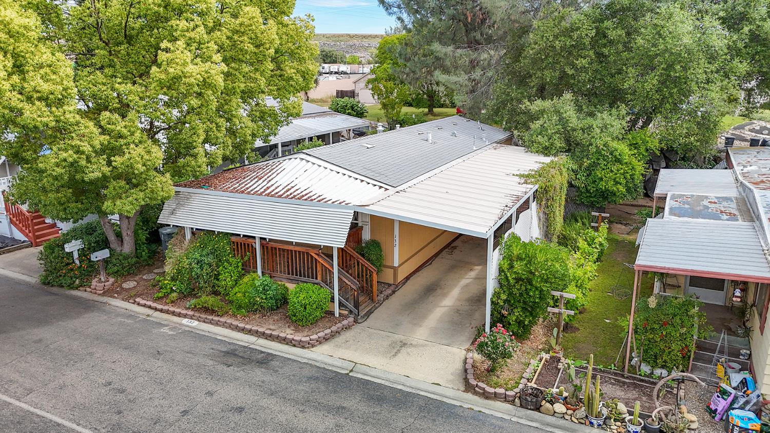 132 Danielle Way Folsom, CA 95630 - Photo 4 of 52 an aerial view of a house with yard and trees in the background