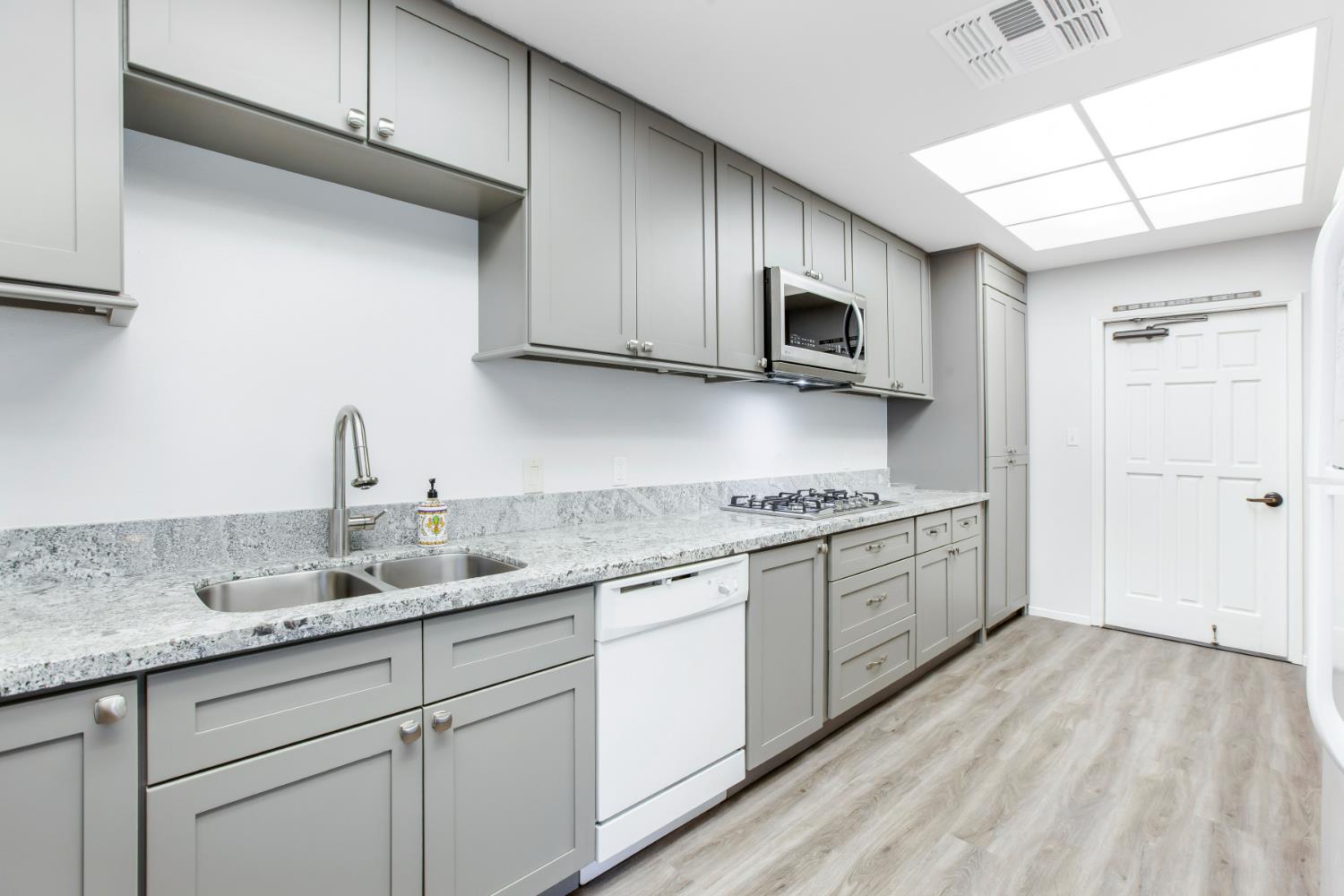 132 Danielle Way Folsom, CA 95630 - Photo 50 of 52 a kitchen with stainless steel appliances granite countertop a sink stove and microwave