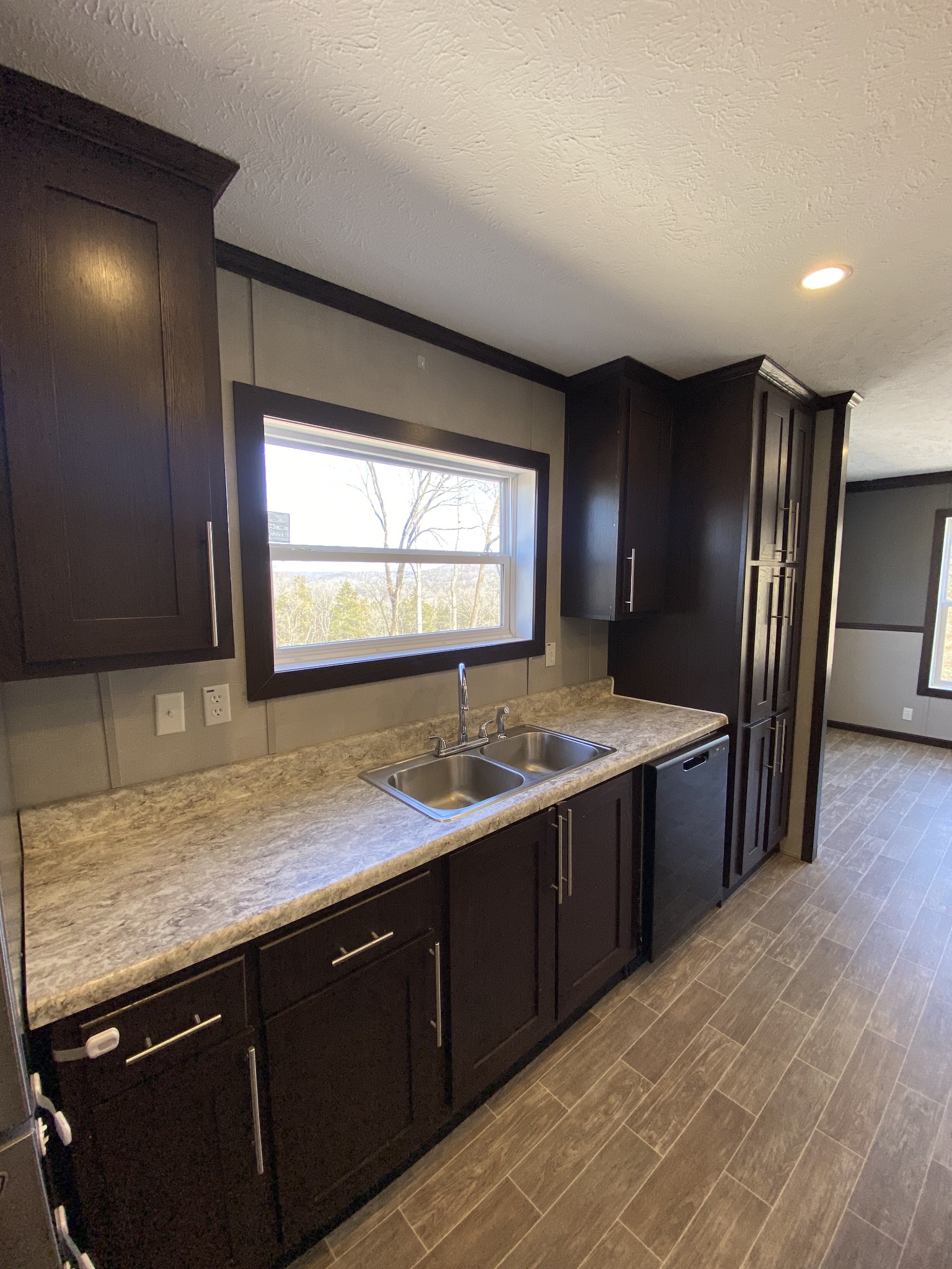 371 Cortner Road Normandy, TN 37360 - Photo 15 of 36 a kitchen with stainless steel appliances granite countertop sink refrigerator and window