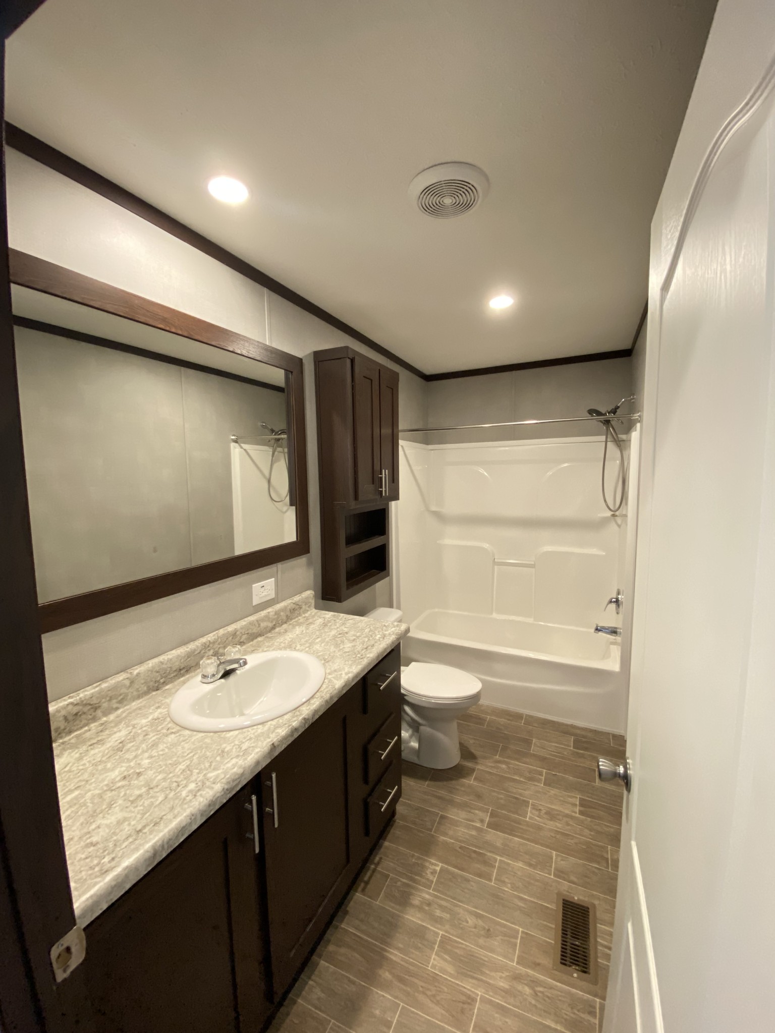 371 Cortner Road Normandy, TN 37360 - Photo 20 of 36 a bathroom with a granite countertop sink a toilet and mirror