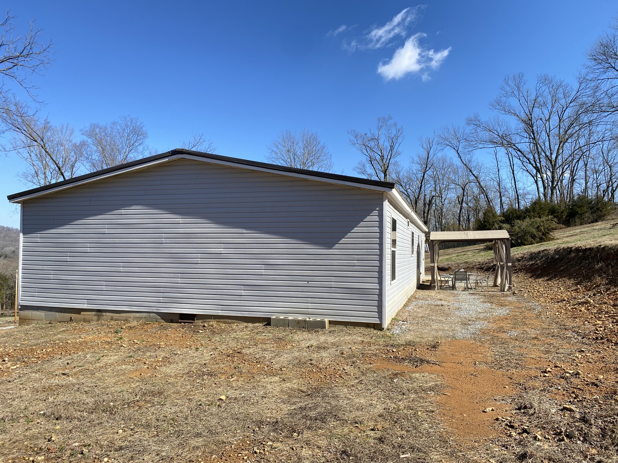 371 Cortner Road Normandy, TN 37360 - Photo 3 of 36 a backyard of a house with large trees