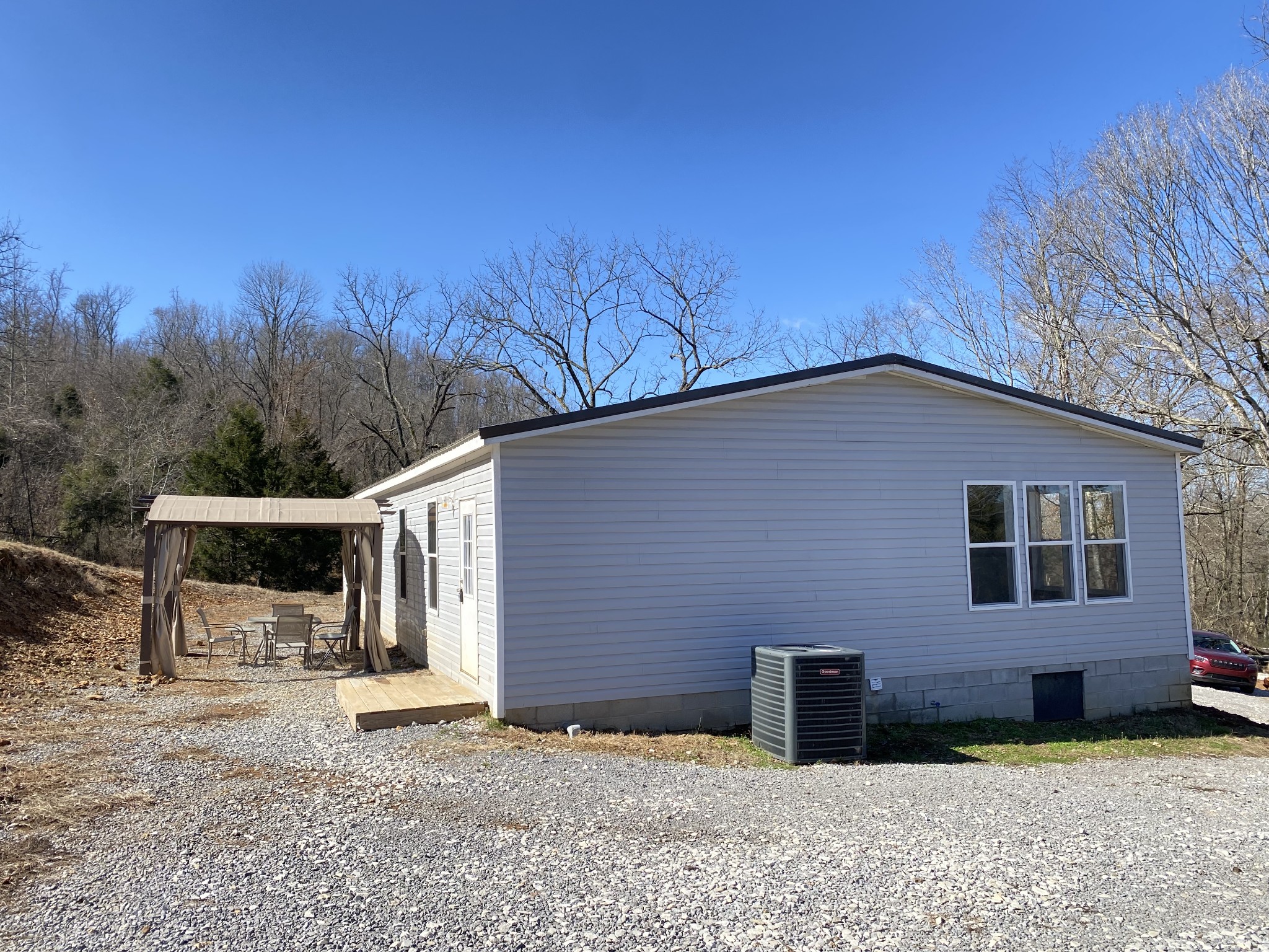 371 Cortner Road Normandy, TN 37360 - Photo 4 of 36 a backyard of a house with yard and outdoor seating