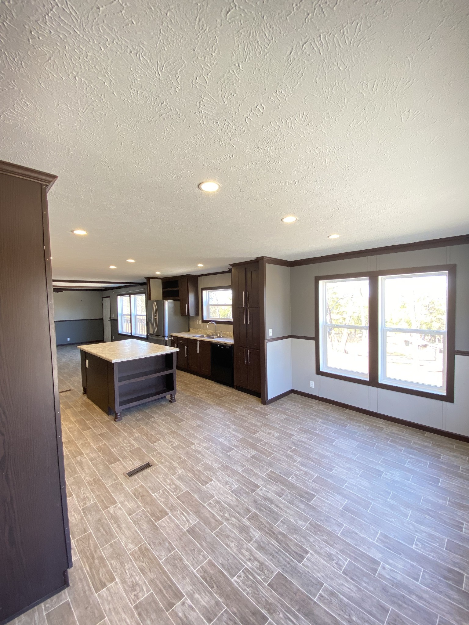 371 Cortner Road Normandy, TN 37360 - Photo 10 of 36 an empty room with large windows and wooden floor