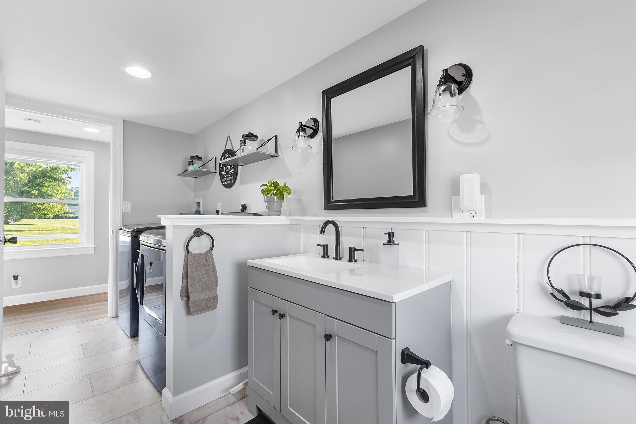 25485 Hignutt Road Denton, MD 21629 - Photo 35 of 52 a bathroom with a toilet sink and mirror