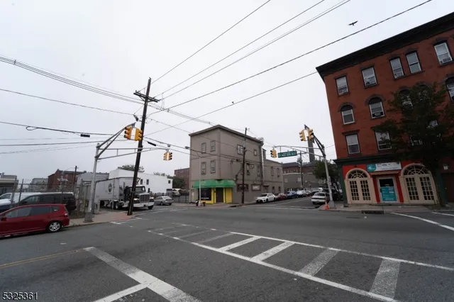 a view of a city street with tall buildings