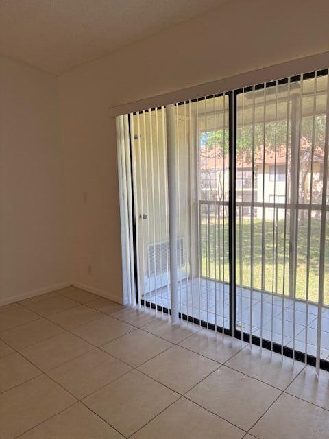 21938 Remsen Terrace, Unit 209 Boca Raton, FL 33433 - Photo 17 of 20 a view of an empty room with a window