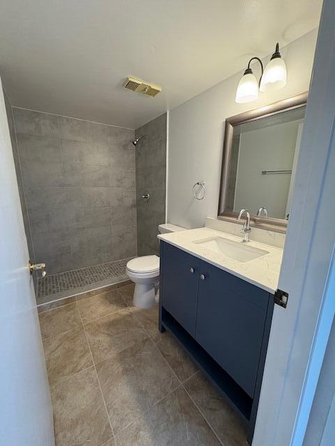 21938 Remsen Terrace, Unit 209 Boca Raton, FL 33433 - Photo 8 of 20 a bathroom with a sink mirror toilet and shower