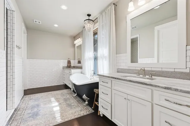 a kitchen with refrigerator and cabinets