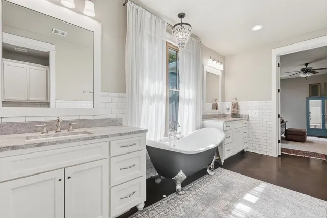 a bedroom with a large bed and a couch