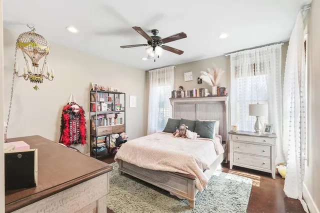 a spacious bathroom with a sink a mirror and a bathtub