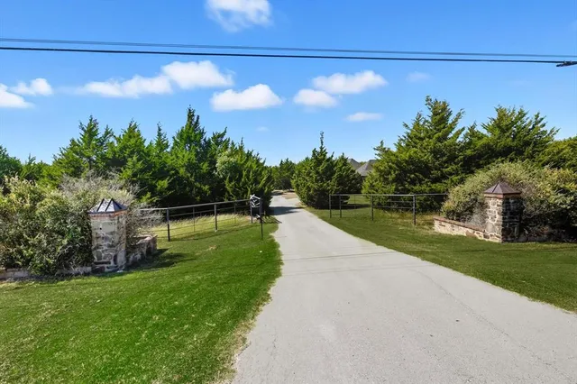 a view of a yard with a swimming pool