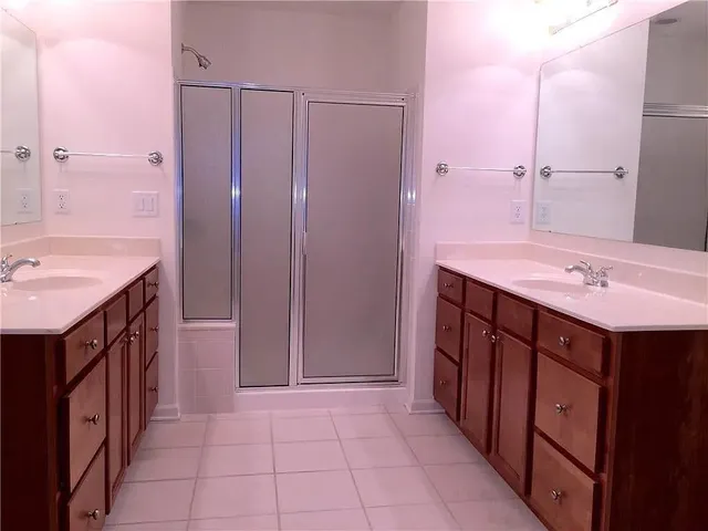 a bathroom with a sink vanity and a mirror