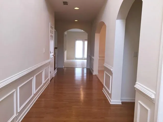 a view of gallery with wooden floor