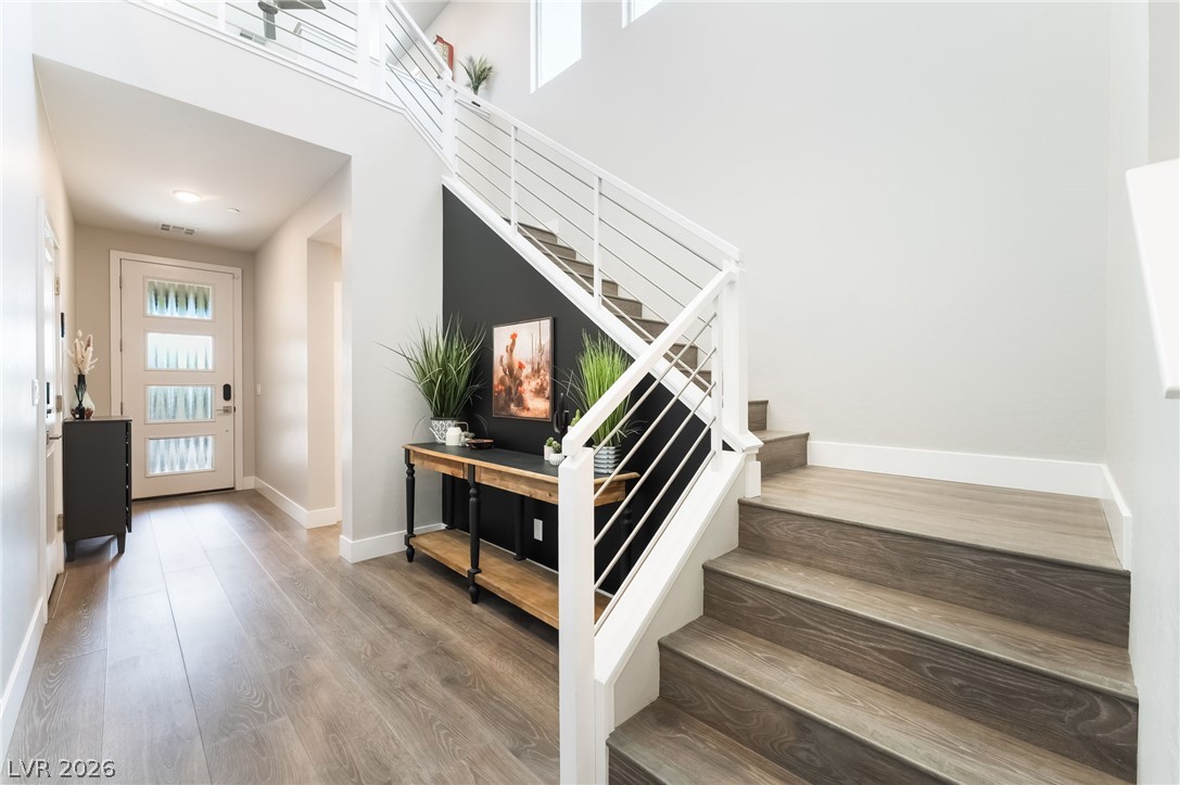 2166 Trivero Street Henderson, NV 89044 - Photo 5 of 61 Ascend to comfort on these wood stairs with contemporary cable railing, anchoring a naturally illuminated entry.