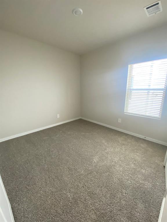 3220 Shortgrass Lane Melissa, TX 75454 - Photo 13 of 17 an empty room with a window