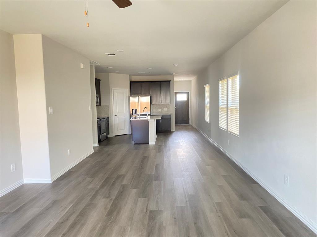 3220 Shortgrass Lane Melissa, TX 75454 - Photo 8 of 17 a view of empty room with wooden floor and window