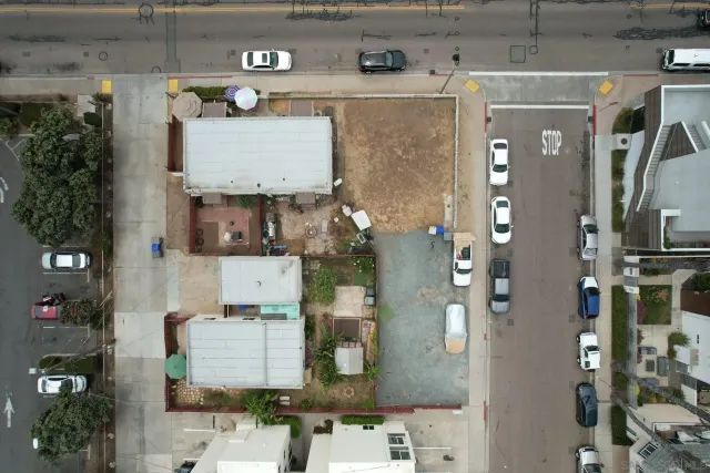 an aerial view of residential houses with outdoor space
