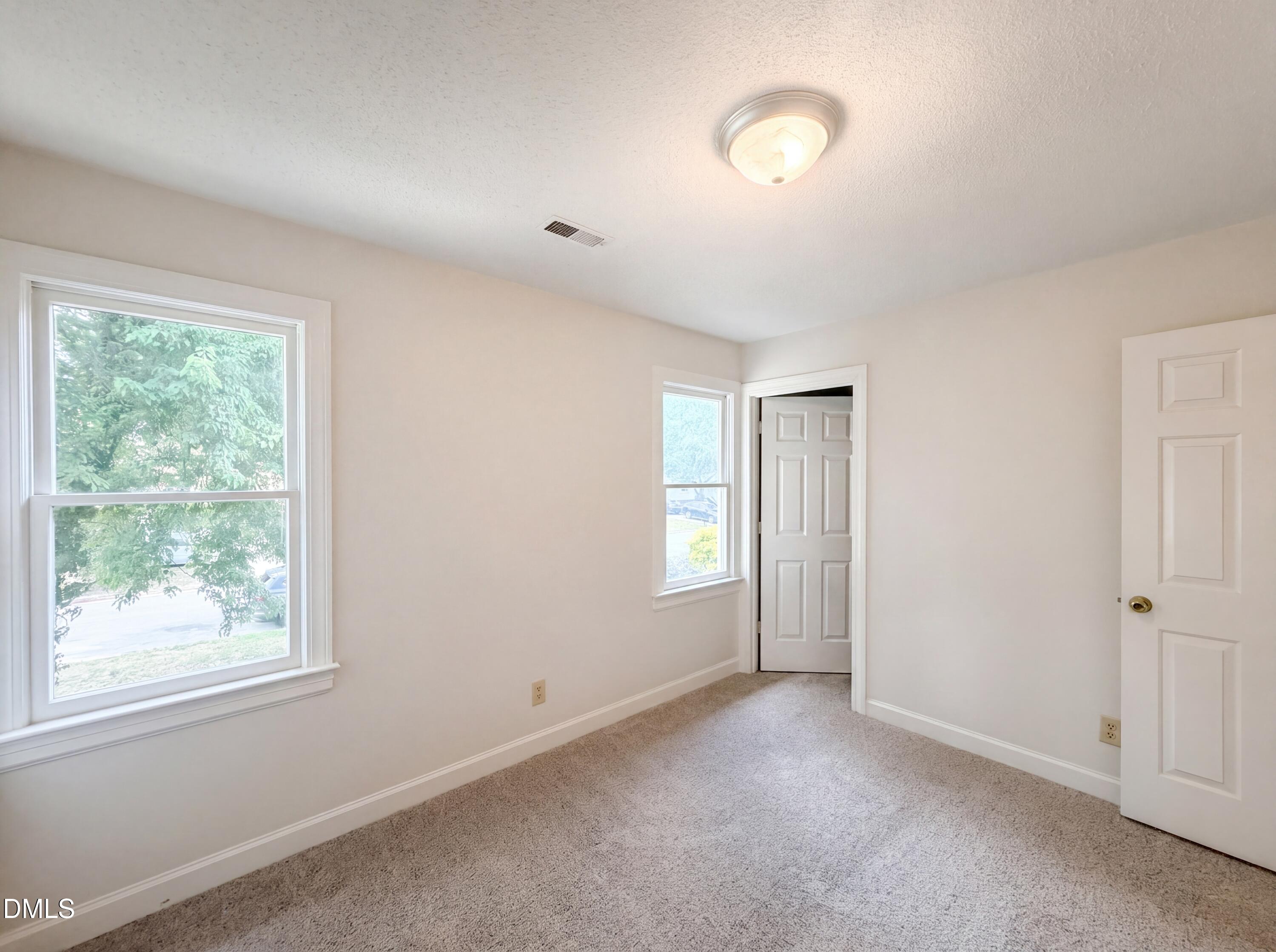 3921 Iron Horse Road Raleigh, NC 27616 - Photo 7 of 20 a view of an empty room with a window
