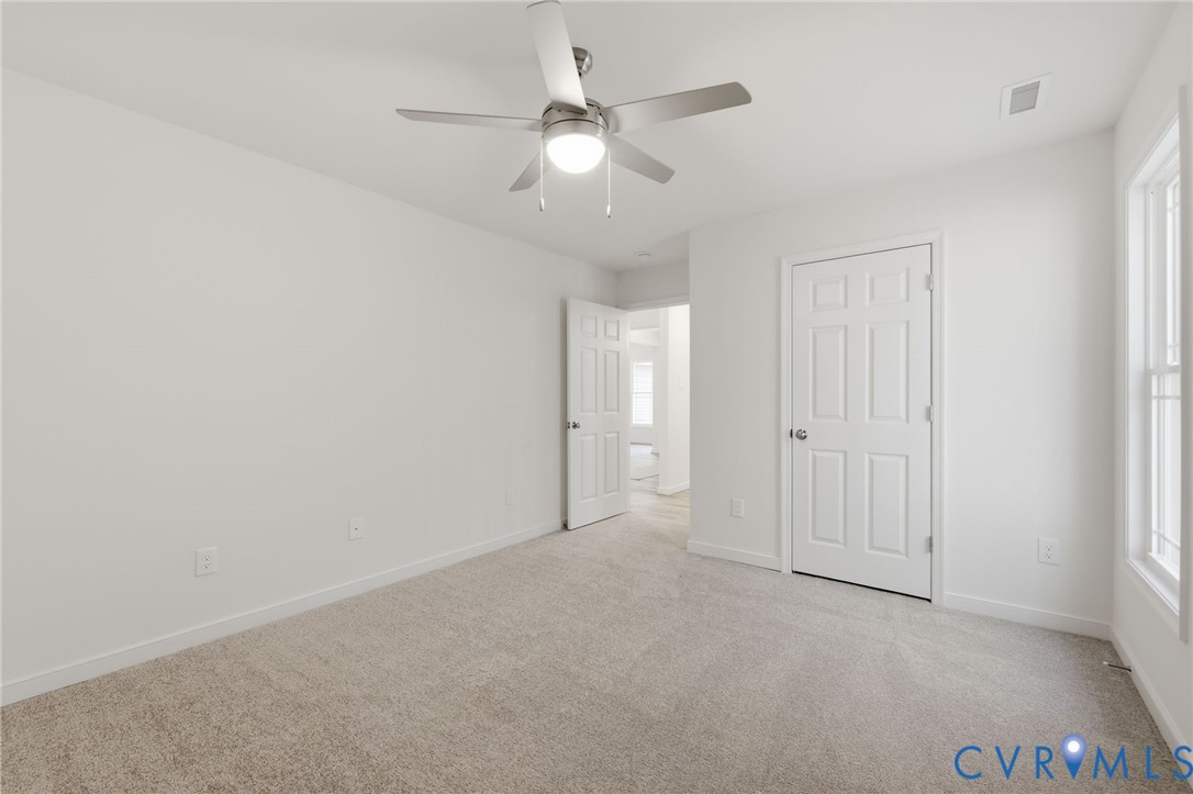 2460 Ballsville Road Powhatan, VA 23139 - Photo 17 of 28 an empty room with fan and ceiling fan