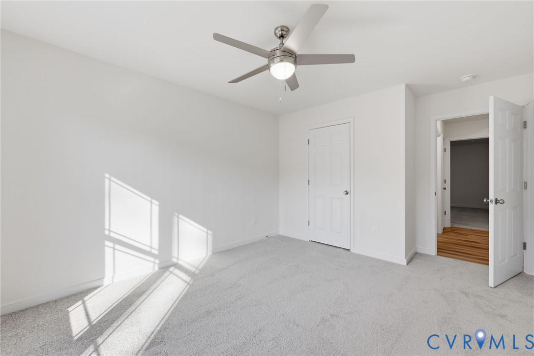 2460 Ballsville Road Powhatan, VA 23139 - Photo 20 of 28 a view of an empty room with a ceiling fan