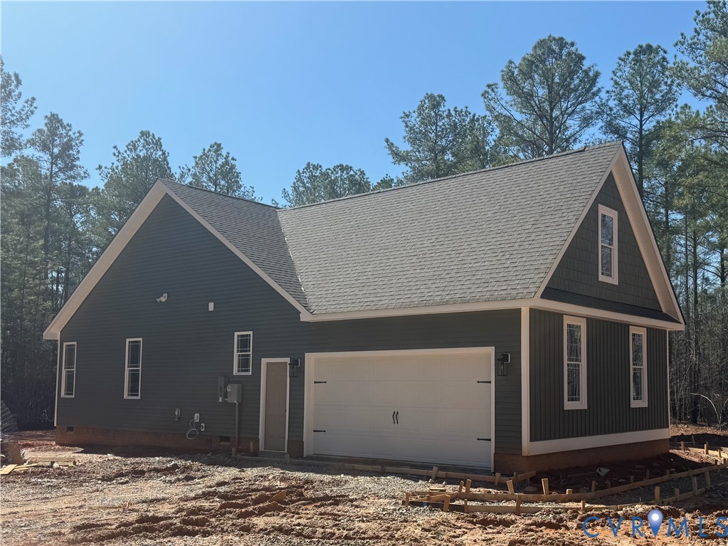 2460 Ballsville Road Powhatan, VA 23139 - Photo 2 of 28 a house with trees in the background
