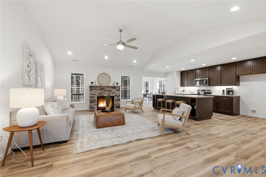 2460 Ballsville Road Powhatan, VA 23139 - Photo 7 of 28 a living room with furniture kitchen view and a chandelier