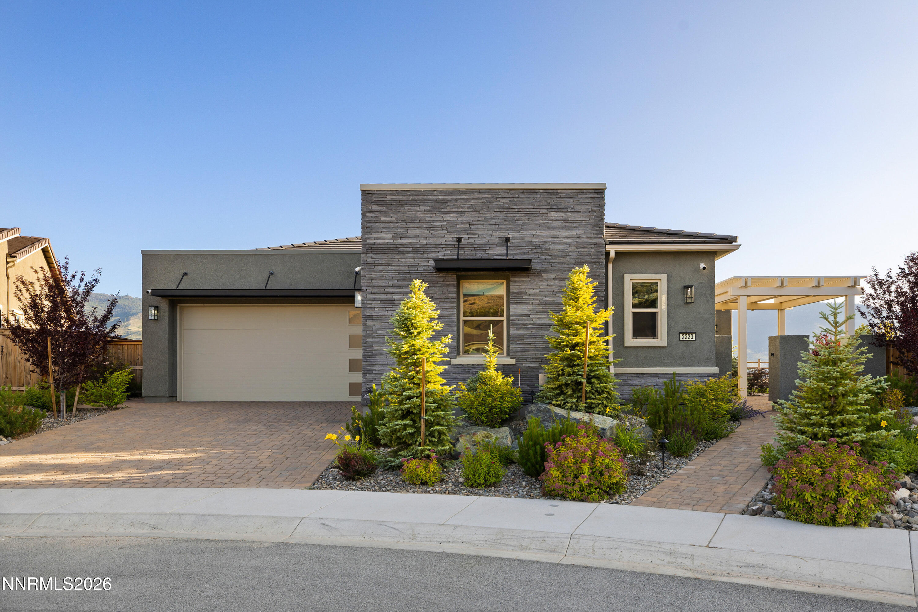2223 Hillsborough Street Reno, NV 89523 - Photo 2 of 41 a front view of a house with a garden