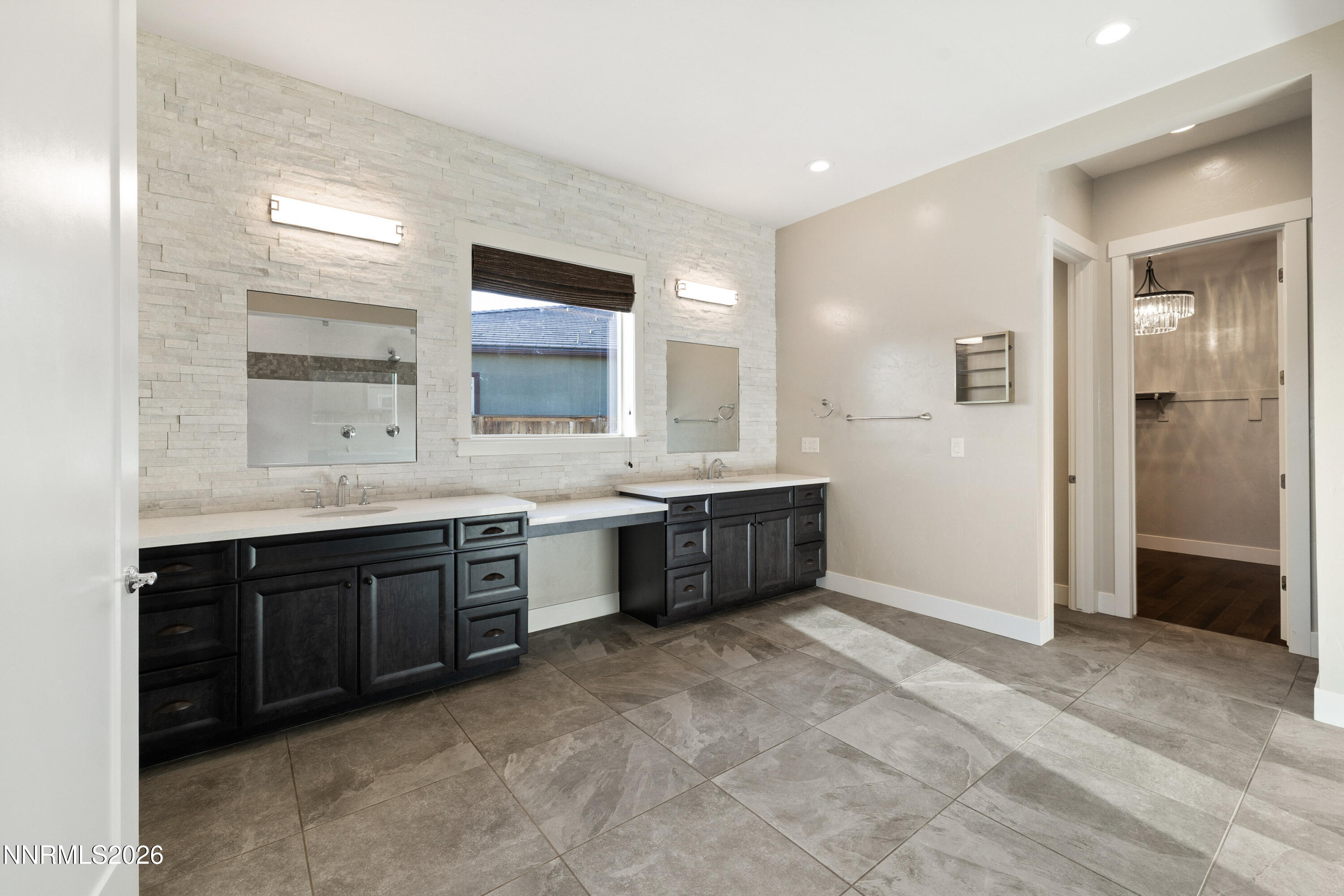2223 Hillsborough Street Reno, NV 89523 - Photo 23 of 41 a bathroom with a double vanity sink mirror and bathtub