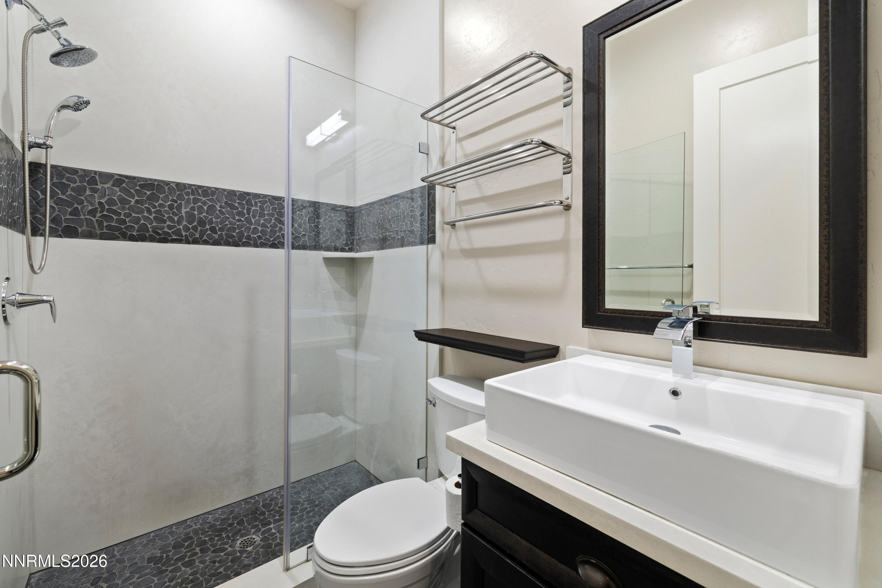 2223 Hillsborough Street Reno, NV 89523 - Photo 25 of 41 a bathroom with a sink a toilet and shower