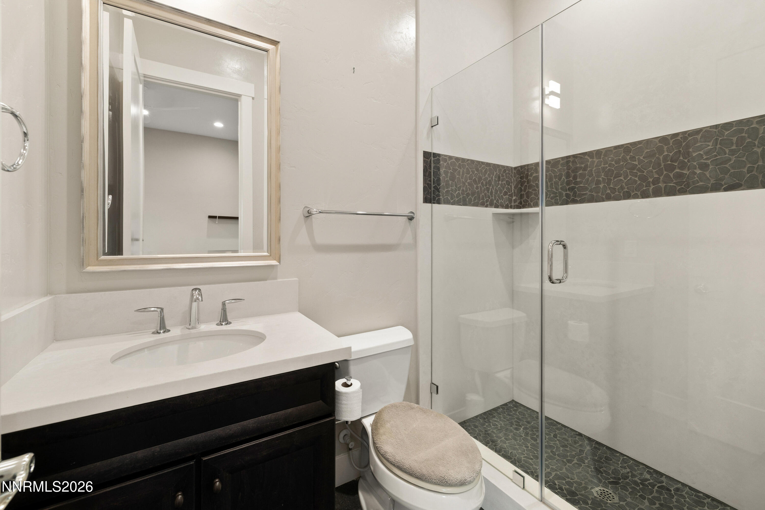 2223 Hillsborough Street Reno, NV 89523 - Photo 26 of 41 a bathroom with a sink a toilet and shower