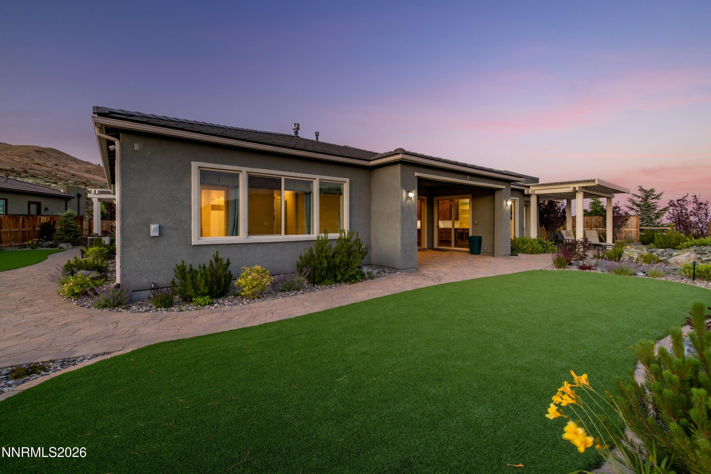 2223 Hillsborough Street Reno, NV 89523 - Photo 6 of 41 a front view of a house with a yard and potted plants