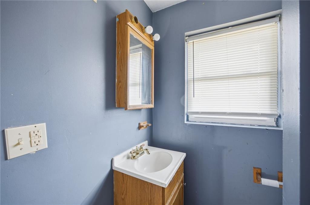 1450 Fleming Avenue McKees Rocks, PA 15136 - Photo 17 of 29 a bathroom with a sink mirror and window