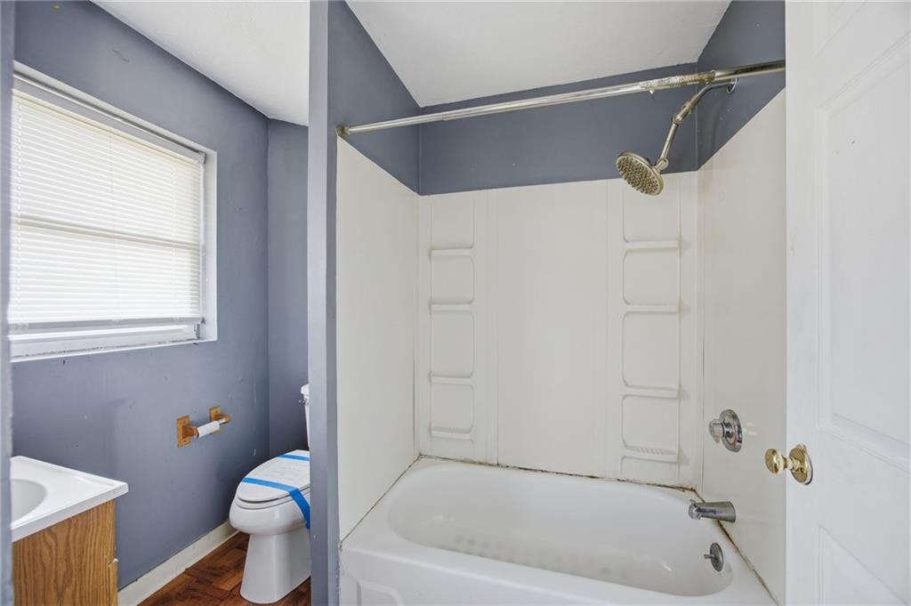1450 Fleming Avenue McKees Rocks, PA 15136 - Photo 18 of 29 a bath room with a toilet and a bath tub