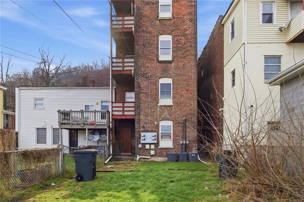 1450 Fleming Avenue McKees Rocks, PA 15136 - Photo 28 of 29 a backyard of a house with lots of green space and fountain